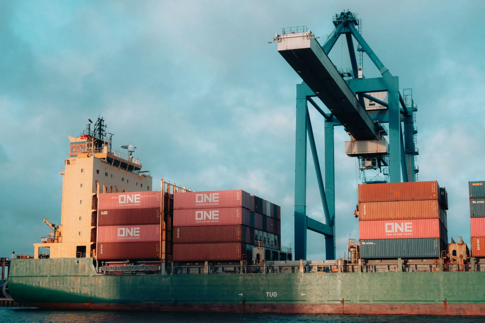 Container cargo ship loaded with cargo containers in a shipping port